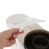 A hand is shown opening a lid on a white storage unit. Náhled obrázku produktu