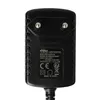 A close-up view of a black AC/DC adapter with product information printed on it. Produktbild-Vorschau