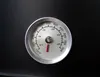A close-up of a thermometer on a black surface. Produktbild-Vorschau