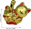 A golden lucky cat figurine with red accents, shown from a slightly elevated side angle. Produktbild-Vorschau