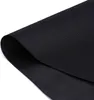 A close-up shot of a black fabric material, likely weed fleece, folded and presented against a white background. Produktbild-Vorschau