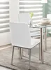 A dining room setting with a glass-top table and white chairs. Anteprima dell’immagine prodotto