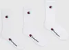Three pairs of white Champion crew socks are laid out against a white background. Produktbild-Vorschau
