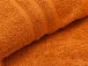 A close-up view of an orange towel, showing its texture and folded edges. Anteprima dell’immagine prodotto