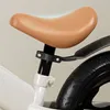A close-up view of a bicycle seat and rear wheel. Náhled obrázku produktu