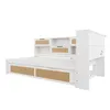A white daybed with storage drawers and a headboard with shelves, shown from a side angle against a white background. Voir les images du produit