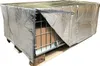 A silver insulated cover is placed over a wire cage pallet containing cardboard boxes, which is itself on a wooden pallet. Produktbild-Vorschau