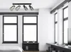 A modern bedroom with large windows and a ceiling light. Produktbild-Vorschau