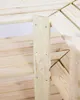 A close-up view of the corner joint of a wooden shelving unit, showing the construction details and fasteners. Produktbild-Vorschau