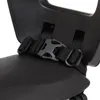 A close-up view of a black buckle and strap on a child seat. Produktbild-Vorschau