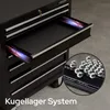 A black tool chest with an open drawer, showing ball bearings in a close-up inset. The text 'Kugellager System' is visible at the bottom. Náhled obrázku produktu