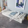 A child's bed with bedding and pillows in a bedroom setting. Produktbild-Vorschau