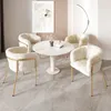 A round dining table with four chairs in a dining room setting. Podgląd zdjęcia produktu
