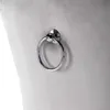 A close-up shot of a silver ring detail on a gray upholstered chair. Podgląd zdjęcia produktu