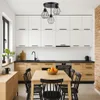 A modern kitchen with white cabinets, wooden lower cabinets, a black countertop, and a dining table with chairs. Produktbild-Vorschau