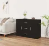 A black sideboard is placed in a living room next to a sofa. Produktbild-Vorschau