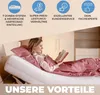 A woman reading in bed with an adjustable bed frame. Produktbild-Vorschau