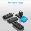 Several black power banks are displayed on a light gray surface, with one plugged into a wall socket via a black adapter and cable. Anteprima dell’immagine prodotto