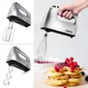 A collage of a silver hand mixer, showing different attachments and a final shot of waffles with berry topping. Produktbild-Vorschau