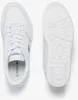 A top-down view of a pair of white Lacoste sneakers, with one shoe shown from the top and the other from the sole. Náhľad obrázku produktu