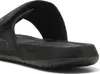 A close-up view of a black PUMA slide sandal. Produktbild-Vorschau
