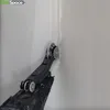 A tool is being used to apply tape to a corner of a wall. Náhľad obrázku produktu