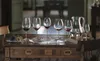 A table set with wine glasses and a pitcher of water, suggesting a formal dining or tasting setting. Podgląd zdjęcia produktu