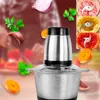 A food chopper is shown in the foreground, surrounded by floating ingredients like onions, garlic, parsley, and carrots. In the background, there are inset images showing the chopper processing different ingredients. Produktbild-Vorschau