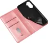 A pink leather flip phone case is shown open, with the black phone holder insert pulled back. Produktbild-Vorschau