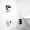 A bathroom corner with toilet paper holders and a toilet brush holder next to a toilet. Anteprima dell’immagine prodotto