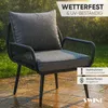 An outdoor chair with cushions is shown in the rain on a patio. Anteprima dell’immagine prodotto