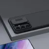 Close-up of a black phone case with a sliding camera cover and textured back, resting on a gray surface. Náhľad obrázku produktu