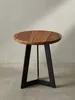 Niedriger Holztisch im industriellen Stil mit 35 cm Durchmesser und schwarz lackierten Eisenbeinen in leicht seitlicher Ansicht._#sku_BARWL5.665# Produktbild-Vorschau
