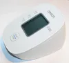 A white Omron blood pressure monitor is shown on a light gray and white surface. Náhľad obrázku produktu