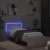 A bedroom scene with a white bed frame featuring blue LED lighting. Anteprima dell’immagine prodotto
