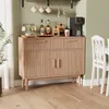 A wooden sideboard with coffee-related items on top, next to a white chair and table. Podgląd zdjęcia produktu