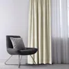 A chair with a pillow next to a cream-colored curtain. Podgląd zdjęcia produktu