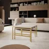 A modern living room with a sofa, bookshelf, and coffee table. Voir les images du produit