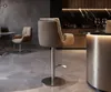 A modern kitchen or dining area with a bar stool, chairs, and a counter. Produktbild-Vorschau