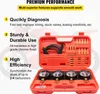 A red carrying case for a motorcycle carburetor synchronization tool kit is open, displaying the tools and gauges inside. The background shows a blurred image of a motorcycle. Voir les images du produit