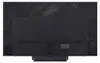 The back of a black LG television with a textured dark gray background. Podgląd zdjęcia produktu