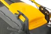 A close-up view of the top section of a lawnmower, focusing on the yellow plastic cover and gray handle. Produktbild-Vorschau