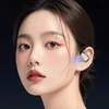 A close-up portrait of a woman wearing an earbud, with a blue light emanating from the earbud. Produktbild-Vorschau