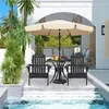 An outdoor patio setting with a table, chairs, and umbrella next to a pool. Produktbild-Vorschau