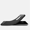 A black TPU phone case with a carbon fiber look is shown bent over a black smartphone. Produktbild-Vorschau