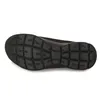 The sole of a black shoe is shown against a white background. Voir les images du produit