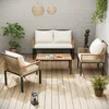 An outdoor patio set with a sofa, two chairs, and a coffee table, set against a brick wall and wooden floor. Anteprima dell’immagine prodotto