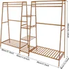 A wooden clothing rack with shelves, shown from a side-angle against a white background. Náhled obrázku produktu