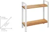 A two-tier shelf unit with wooden shelves and white metal frame, shown against a white background. A diagram with dimensions is present to the left. Anteprima dell’immagine prodotto