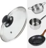 A collage of kitchenware items including a glass pot lid, a small saucepan, a larger pot, and a frying pan. Náhled obrázku produktu
